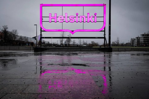 Large pink city logo of Helsinki near Oodi Central Library and Cultural Center, Helsinki, Finland