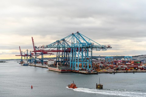 Container port with huge cranes and lots of colorful containers on the water, Stena Line