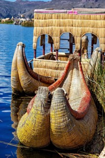 Traditional boats made of reeds on a lake, handmade, The floating reed islands of the Uros in Lake