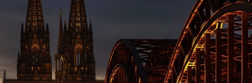 Evening atmosphere, Cologne Cathedral illuminated with LED lamps and the Hohenzollern Bridge,