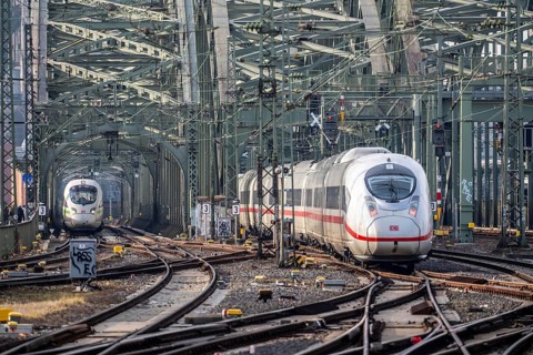 Rail track in front of Cologne Central Station, Hohenzollern Bridge across the Rhine, ICE