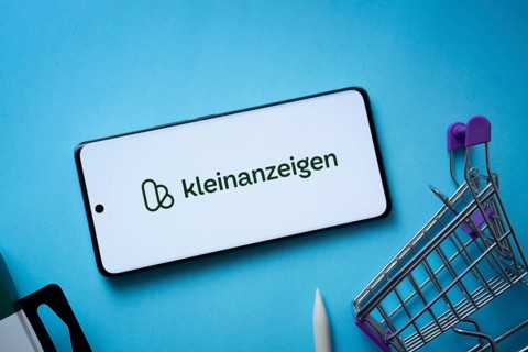 Dhaka, Bangladesh- 03 July 2025: Smartphone displaying Kleinanzeigen logo with shopping cart on a