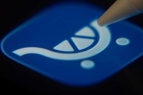 Dhaka, Bangladesh- 06 Dec 2025: Close-up of the Kroger app on a screen with a stylus pointing at it