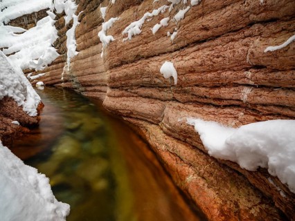 Taugl or Tauglbach flows through the snow-covered and icy red gorge, also Marmorklamm, Bad Vigaun,
