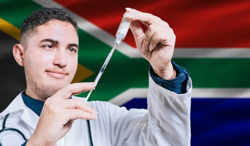 Doctor holding syringe on South Africa flag background. Medical professional holding syringe with