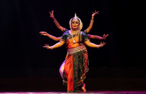 Artists perform Odissi classical dance during a cultural evening program at Shilpgram Mohotsav 2026