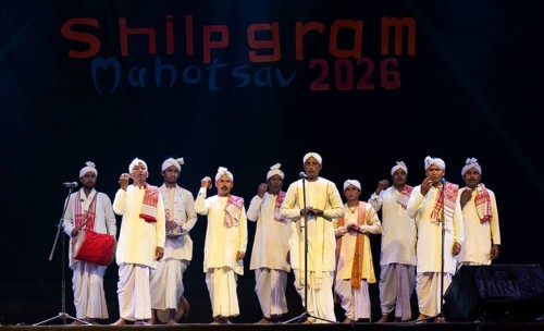 Artists perform 'Ojapali' folk song during a cultural evening program at Shilpgram Mohotsav 2026 in