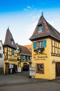 Christmassy decorated houses and alley with half-timbered houses, Christmas market, Eguisheim,