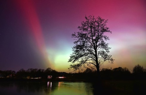Northern lights, northern lights, on a lake in Schleswig-Holstein, Germany