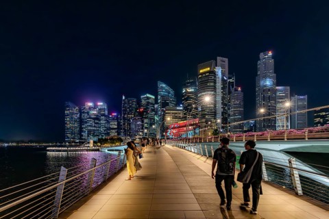 Skyline of the Central Business District, CBD with illuminated skyscrapers and Jubilee Bridge in