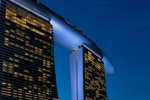 Marina Bay Sands, MBS, luxury 5-star hotel and integrated resort illuminated at dusk in Downtown