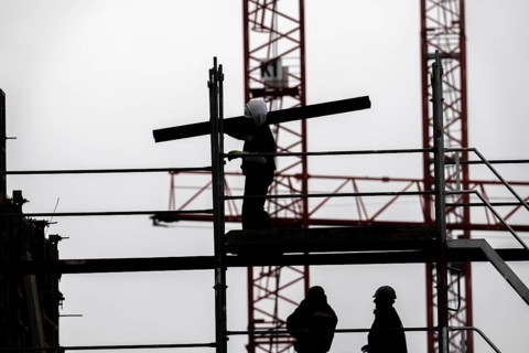 Construction site, scaffolding work on a large construction project, apartments and commercial