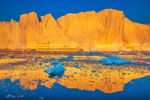 Icebergs at sunset in the Ilulissat Icefjord near the town of Ilulissat, a UNESCO World Heritage
