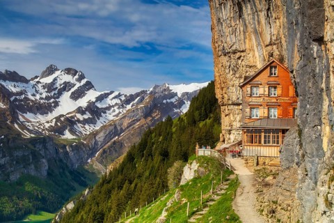 Berggasthaus Aescher restaurant built into the cliff face of Ebenalp, a famous mountain inn near