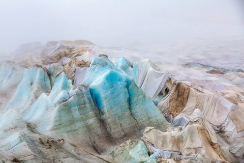 Rhone Glacier covered to protect it from melting, highlighting climate change and global warming,