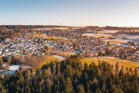Snowy village landscape with adjacent forest and soft colors, Hallwangen, Freudenstadt district,