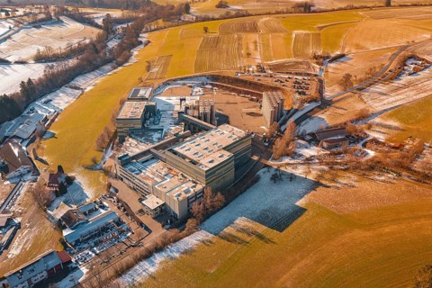 Industrial complex surrounded by wintry fields and snow-covered areas, Hallwangen, Freudenstadt
