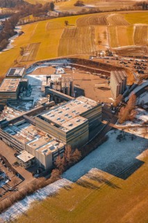 Industrial site in wintry snowy fields and simple countryside, Hallwangen, Freudenstadt district,