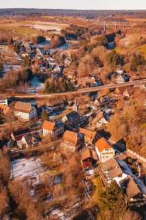 Church in the middle of a snowy village against a forest backdrop, Aach, Dornstetten, Freudenstadt