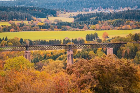 Bridge over an autumn landscape with colorful trees and meadows, Dornstetten, Freudenstadt