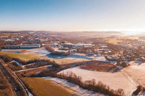 Winter landscape with fields and town houses in soft morning light, Dornstetten, Freudenstadt