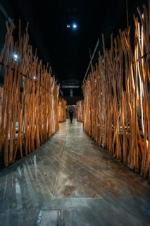 Oblong passage made of wooden bars in a modern art installation, Tate Modern of Art, Lodon, United