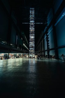 High room with luminous installation, dark industrial atmosphere, Tate Modern of Art, Lodon, United