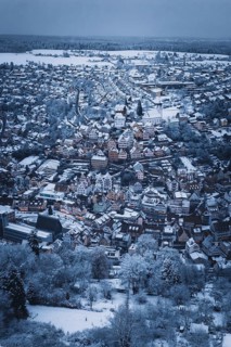 Far-reaching view of a snowy urban landscape with church and houses, Altensteig, Calw district,