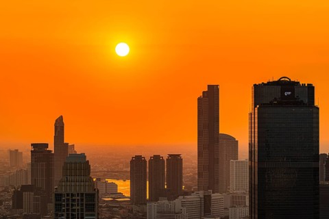 Over the rooftops of Bangkok, sunset, view from the Moon Bar on the roof terrace of the Banyan Tree