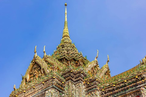 Chedi temple tower with ceramic inlays, Wat Arun Buddhist temple, Bangkok, Thailand's metropolis,