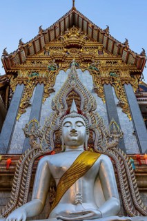 Richly decorated Buddha statue at Wat Suthiwararam Buddhist temple, Bangkok, Thailand's metropolis,