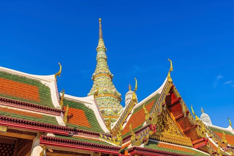 The Grand Royal Palace, Wat Phra Kaeo Buddhist Temple, overlapping roofs with curved chofas, Chedi