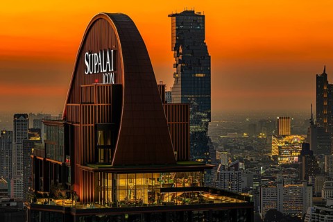 Over the rooftops of Bangkok, sunset, roof structure of the luxury residential residence Supalai