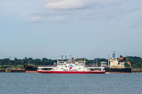 Red Funnel Ferry over refinery Esso Oil Terminal, Southampton, Hampshire, England, United Kingdom
