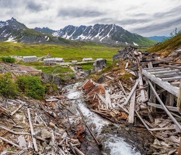Crumbling mill and former Gold Mine Independence Mine building in mountainous landscape,