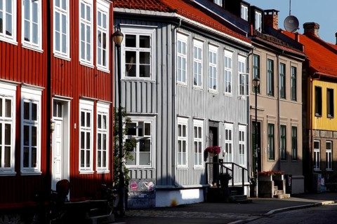 Lively street scene with colorful wooden houses, Trondheim, Trøndelag, Norway