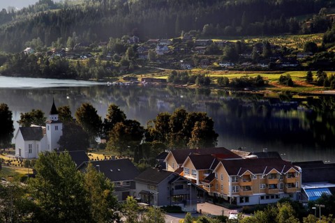 Idyllic village on the Hardangerfjord with a lakeside church, Ulvik, null, Norway