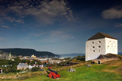 The Kristianstenfestning towers over Trondheim with city view and cannon, Trondheim, Norway