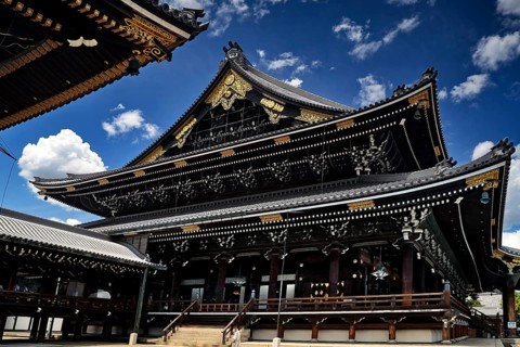 Majestic Higashi Honganji temple under a clear blue sky in Kyoto, Kyoto, Kansai, Japan