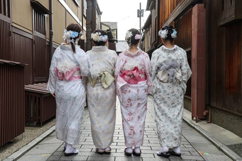 Four woman in kimonos walk through Nakamachi Street in Gion, Gion, Kyoto, Japan