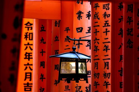 Torii avenue at Fushimi Inari Shrine in Kyoto with red arches, Kyoto, Japan