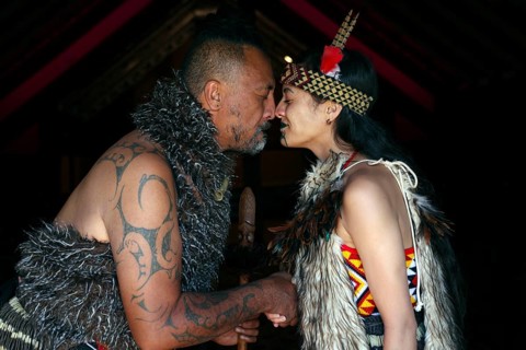 Hongi ceremony between two Maori in traditional dress, Rotorua, Te Puia, New Zealand