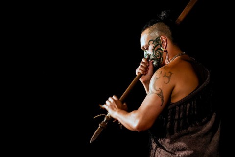 Maori warriors with traditional face painting and tattoo at a cultural performance in Rotorua,