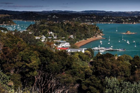 Panoramic view of the Bay of Islands with blue water and surrounding vegetation, Maiki, Bay of
