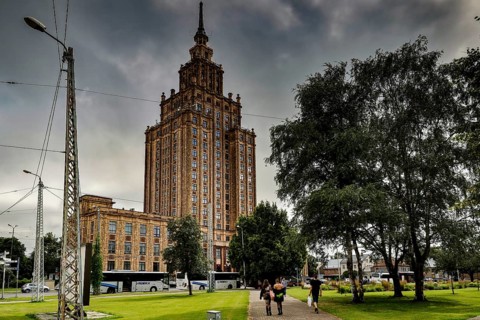 Latvian Academy of Sciences in Riga on a cloudy day with surrounding greenery, Riga, Latvia