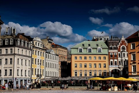 Painted buildings on Cathedral Square in Riga under blue sky, Riga, Latvia