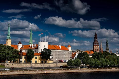 View of Riga Castle and Church Towers over the Düna under cloudy sky, Riga, Vidzeme, Latvia