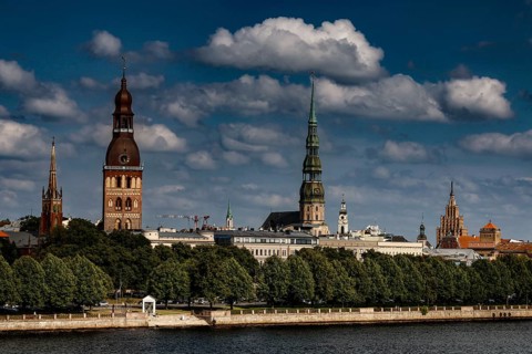 View of Riga's skyline with cathedral, St. Peter's Church and the Duna, Riga, Latvia