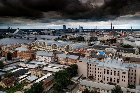 Dramatic city panorama of Riga with clouds above the Central Market, Riga, Latvia, Latvia