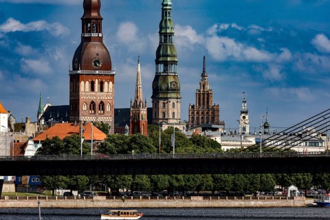 Riga's silhouette with churches on the Düna and distinctive bridge, Riga, Latvia
